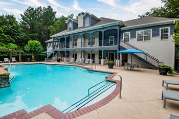 Resort Style Pool with Soothing Waterfall Features and Sundeck